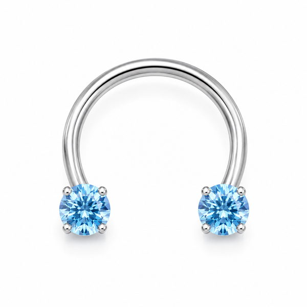 Fer a cheval septum argente 2 zircons bleus griffes - fond blanc