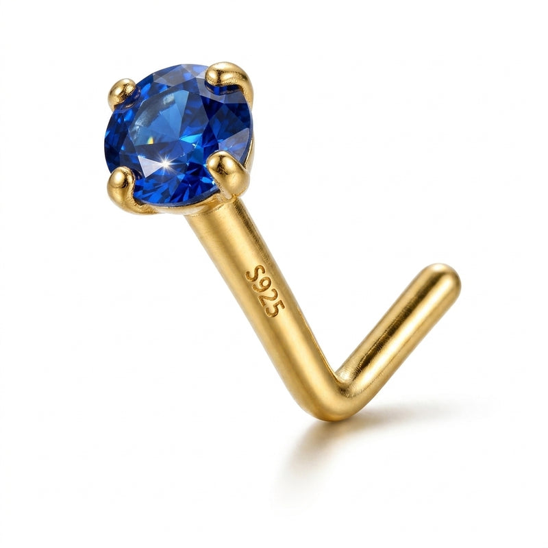 Clou en L argent S925 dore zircon bleu saphir fonce solitaire — fond blanc