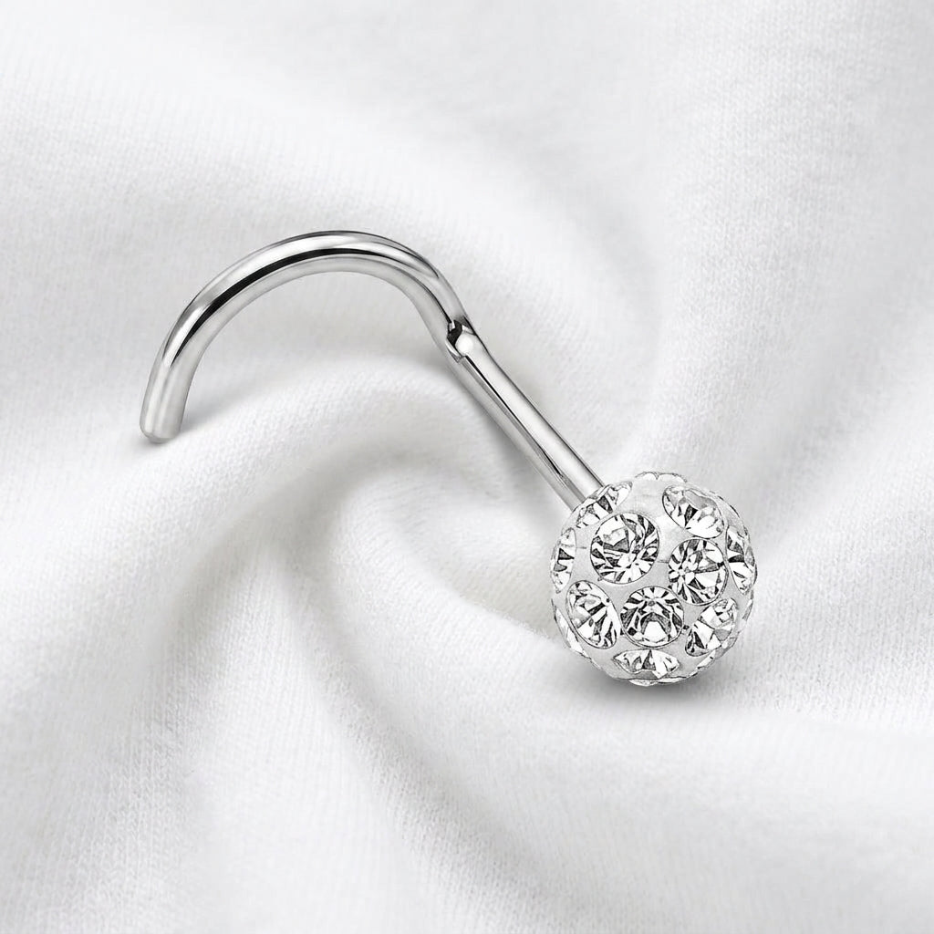 Vis nez argentee boule disco strass blanc — posee sur tissu blanc