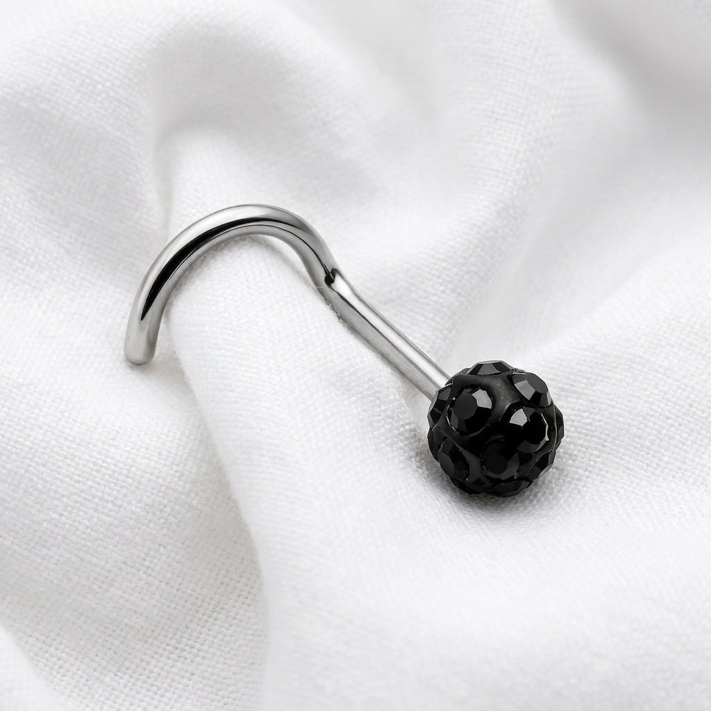Vis nez argentee boule disco strass noir — posee sur tissu blanc