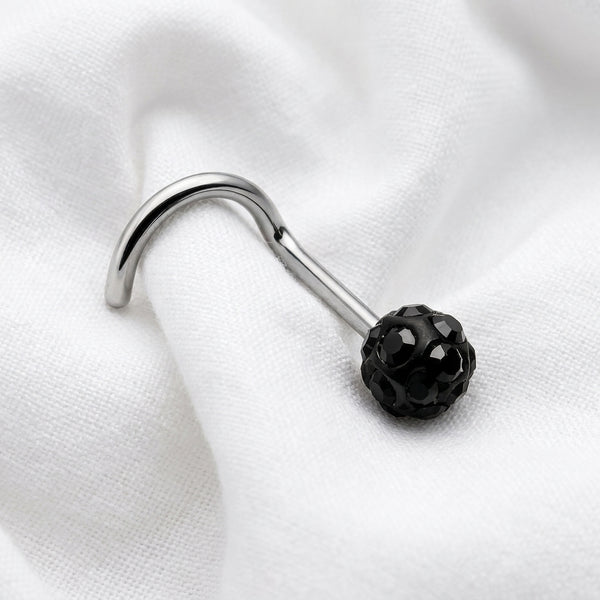 Vis nez argentee boule disco strass noir — posee sur tissu blanc
