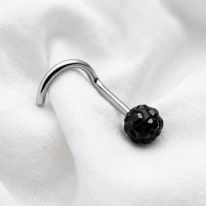 Vis nez argentee boule disco strass noir — posee sur tissu blanc