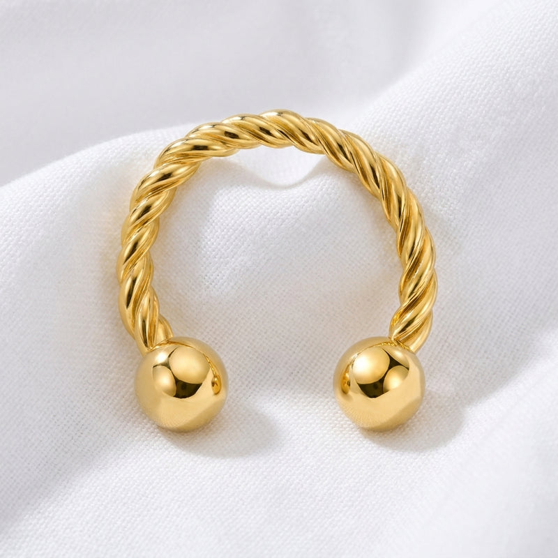 Fer a cheval dore torsade 2 boules — pose tissu blanc