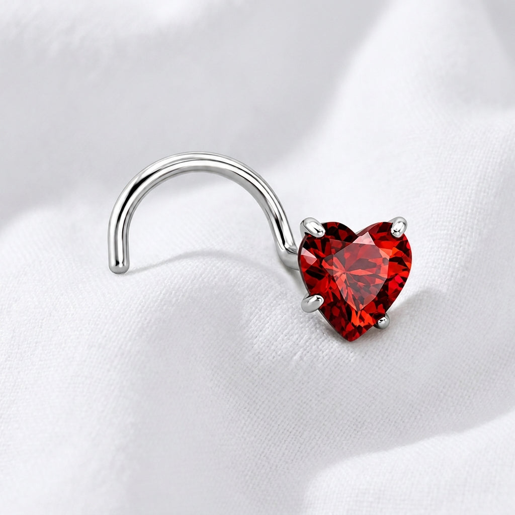 Vis nez argentee zircon coeur rouge — posee sur tissu blanc