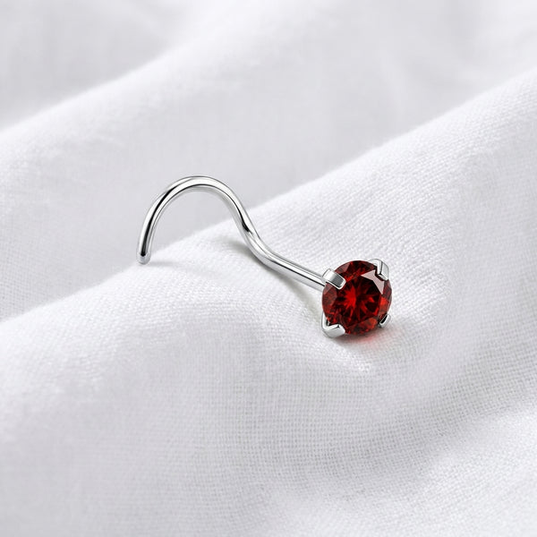 Vis nez argentee zircon solitaire rouge rubis — pose tissu blanc
