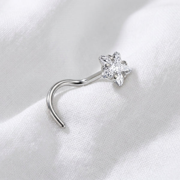 Vis argentee etoile 4 branches zircons marquise — posee tissu blanc